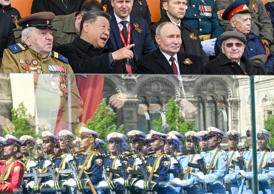 Russian President Vladimir Putin and Chinese President Xi Jinping, second left, on Red Square in Moscow during the military parade to mark the 80th anniversary of Victory. On May 9, Russia celebrates the 80th anniversary of Victory in the Great Patriotic War of 1941-1945. Location: Russia, Moscow. Author: Sergey Bobylev/Sputnik. President of Russia Vladimir Putin and foreign leaders at military parade marking 80th anniversary of Victory