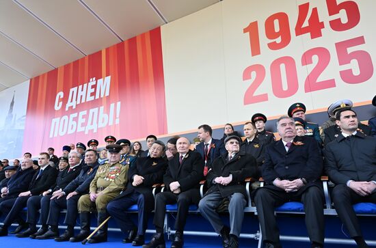 From right: President of Russia Vladimir Putin and President of China Xi Jinping on Red Square in Moscow, where a military parade marking the 80th anniversary of Victory is taking place. Russia marks the 80th anniversary of Victory in the Great Patriotic War of 1941-1945. From left: Prime Minister of Armenia Nikol Pashinyan, President of Belarus Alexander Lukashenko with his son Nikolai, President of Kazakhstan Kassym-Jomart Tokayev, President of the Kyrgyz Republic Sadyr Japarov. From right: President of Turkmenistan Serdar Berdimuhamedov, and President of Tajikistan Emomali Rahmon. Location: Russia, Moscow. President of Russia Vladimir Putin and foreign leaders at military parade marking 80th anniversary of Victory