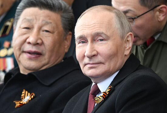 Russian President Vladimir Putin and Chinese President Xi Jinping, left, on Red Square in Moscow during the military parade to mark the 80th anniversary of Victory. On May 9, Russia celebrates the 80th anniversary of Victory in the Great Patriotic War of 1941-1945. Location: Russia, Moscow. Author: Sergey Bobylev/Sputnik. President of Russia Vladimir Putin and foreign leaders at military parade marking 80th anniversary of Victory