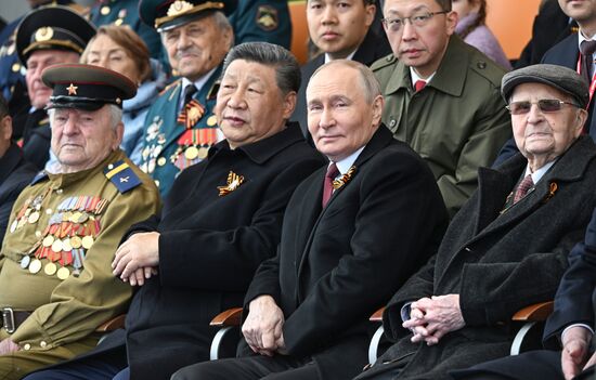 President of Russia Vladimir Putin and President of China Xi Jinping, second left, on Red Square in Moscow, where a military parade marking the 80th anniversary of Victory is taking place. Russia marks the 80th anniversary of Victory in the Great Patriotic War of 1941-1945. Location: Russia, Moscow. Author: Sergey Bobylev/Sputnik. President of Russia Vladimir Putin and foreign leaders at military parade marking 80th anniversary of Victory