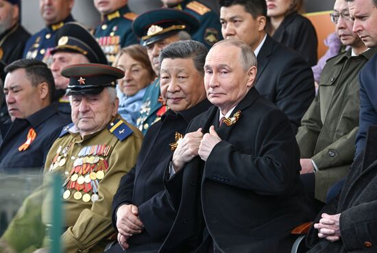 Russian President Vladimir Putin and Chinese President Xi Jinping, center, left, on Red Square in Moscow during the military parade to mark the 80th anniversary of Victory. On May 9, Russia celebrates the 80th anniversary of Victory in the Great Patriotic War of 1941-1945. Location: Russia, Moscow. Author: Sergey Bobylev/Sputnik. President of Russia Vladimir Putin and foreign leaders at military parade marking 80th anniversary of Victory