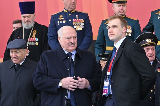 Belarusian President Alexander Lukashenko and his son Nikolai on Red Square in Moscow during the military parade to mark the 80th anniversary of Victory. On May 9, Russia celebrates the 80th anniversary of Victory in the Great Patriotic War of 1941-1945. Left: Armenian Prime Minister Nikol Pashinyan. Location: Russia, Moscow. Author: Ilya Pitalev/Sputnik. President of Russia Vladimir Putin and foreign leaders at military parade marking 80th anniversary of Victory