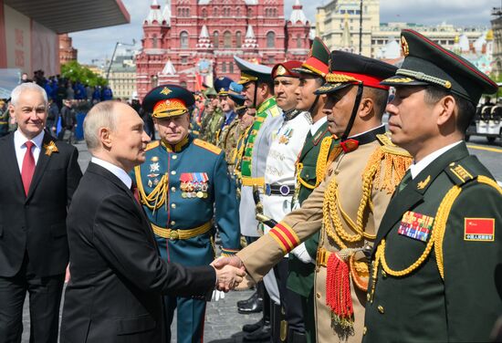 President of Russia Vladimir Putin on Red Square in Moscow during the military parade to mark the 80th anniversary of Victory. On May 9, Russia celebrates the 80th anniversary of Victory in the Great Patriotic War of 1941-1945. Left: Russian Defense Minister Andrei Belousov. Center: Commander-in-Chief of the Russian Ground Forces Oleg Salyukov. Location: Russia, Moscow. Author: Evgeny Biyatov/Sputnik. President of Russia Vladimir Putin and foreign leaders at military parade marking 80th anniversary of Victory