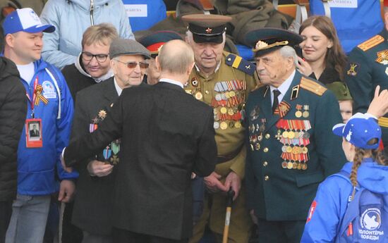 President of Russia Vladimir Putin greets Great Patriotic War veterans during a military parade to mark the 80th anniversary of Victory. Russia marks the 80th anniversary of Victory in the Great Patriotic War of 1941-1945. Location: Russia, Moscow. Author: Alexey Maishev/Sputnik. President of Russia Vladimir Putin and foreign leaders at military parade marking 80th anniversary of Victory