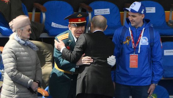 President of Russia Vladimir Putin greets a veteran of the Great Patriotic War on Red Square in Moscow, where a military parade marking the 80th anniversary of Victory is taking place. Russia marks the 80th anniversary of Victory in the Great Patriotic War of 1941-1945. Location: Russia, Moscow. Author: Alexey Maishev/Sputnik. President of Russia Vladimir Putin and foreign leaders at military parade marking 80th anniversary of Victory