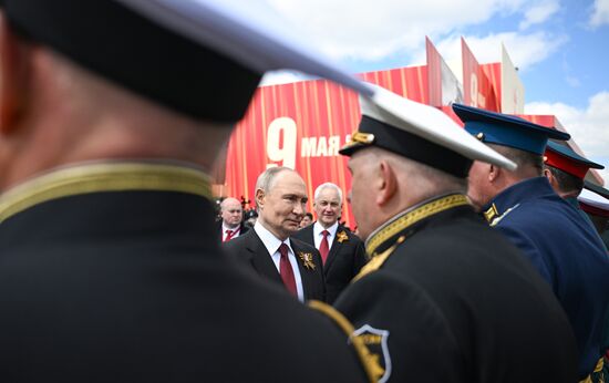 President of Russia Vladimir Putin and Defense Minister Andrei Belousov, center right, on Red Square in Moscow during the military parade to mark the 80th anniversary of Victory. On May 9, Russia celebrates the 80th anniversary of Victory in the Great Patriotic War of 1941-1945. Location: Russia, Moscow. Author: Sergey Bobylev/Sputnik. President of Russia Vladimir Putin and foreign leaders at military parade marking 80th anniversary of Victory