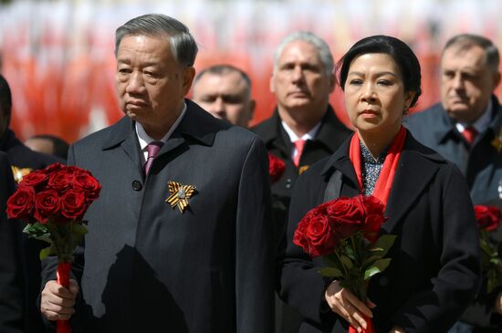 General Secretary of the Communist Party of Vietnam To Lam and his wife, Ngo Phuong Ly, at a joint wreath-laying ceremony by President of Russia Vladimir Putin and foreign leaders at the Tomb of the Unknown Soldier in Alexander Garden, Moscow. Russia marks the 80th anniversary of Victory in the Great Patriotic War of 1941-1945. Location: Russia, Moscow. Author: Grigory Sysoev/Sputnik. Wreath-laying ceremony at the Tomb of the Unknown Soldier