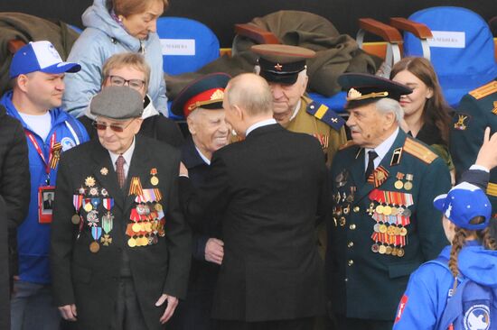 President of Russia Vladimir Putin greets Great Patriotic War veterans during a military parade to mark the 80th anniversary of Victory. Russia marks the 80th anniversary of Victory in the Great Patriotic War of 1941-1945. Location: Russia, Moscow. Author: Alexey Maishev/Sputnik. President of Russia Vladimir Putin and foreign leaders at military parade marking 80th anniversary of Victory