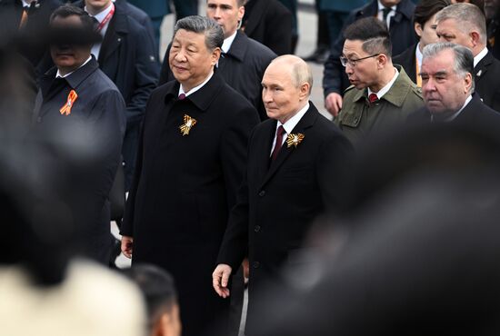 President of Russia Vladimir Putin and Chinese President Xi Jinping, left, and President of Tajikistan Emomali Rahmon, right, at a joint wreath-laying ceremony at the Tomb of the Unknown Soldier in Alexander Garden, Moscow. Russia marks the 80th anniversary of Victory in the Great Patriotic War of 1941-1945. Location: Russia, Moscow. Author: Stanislav Krasilnikov/Sputnik. Wreath-laying ceremony at the Tomb of the Unknown Soldier
