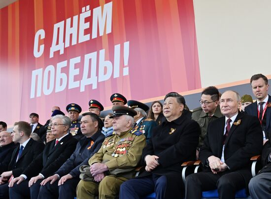 President of Russia Vladimir Putin and President of China Xi Jinping on Red Square in Moscow, where a military parade marking the 80th anniversary of Victory is taking place. Russia marks the 80th anniversary of Victory in the Great Patriotic War of 1941-1945. From left: President of Belarus Alexander Lukashenko with his son Nikolai, President of Kazakhstan Kassym-Jomart Tokayev and President of Kyrgyzstan Sadyr Japarov. Center: veteran in the Great Patriotic War Yevgeny Znamensky. Location: Russia, Moscow. Author: Ivan Sekretarev/Sputnik. President of Russia Vladimir Putin and foreign leaders at military parade marking 80th anniversary of Victory