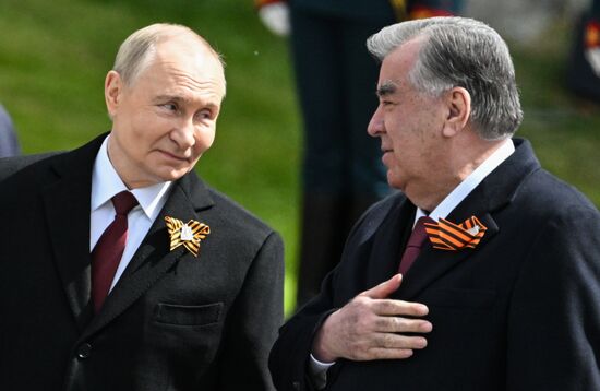 President of Russia Vladimir Putin and President of Tajikistan Emomali Rahmon, right, at a joint wreath-laying ceremony at the Tomb of the Unknown Soldier in Alexander Garden, Moscow. Russia marks the 80th anniversary of Victory in the Great Patriotic War of 1941-1945. Location: Russia, Moscow. Author: Stanislav Krasilnikov/Sputnik. Wreath-laying ceremony at the Tomb of the Unknown Soldier
