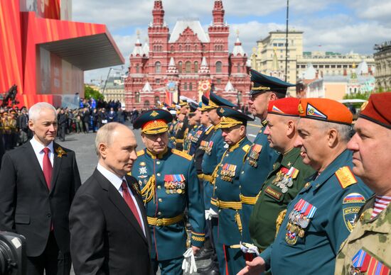 President of Russia Vladimir Putin, Defense Minister Andrei Belousov, left, and Commander-in-Chief of the Army Forces General Oleg Salyukov on Red Square in Moscow, where a military parade marking the 80th anniversary of Victory is taking place. Russia marks the 80th anniversary of Victory in the Great Patriotic War of 1941-1945. Location: Russia, Moscow. Author: Evgeny Biyatov/Sputnik. President of Russia Vladimir Putin and foreign leaders at military parade marking 80th anniversary of Victory