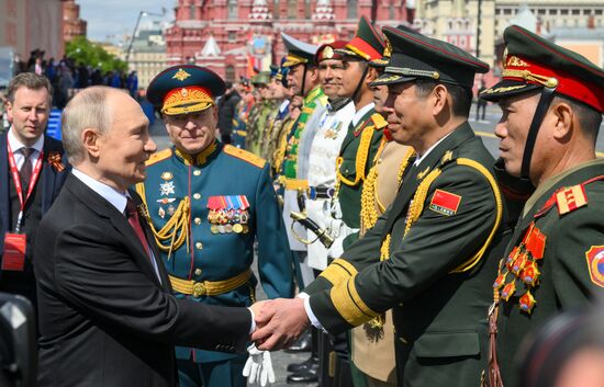 President of Russia Vladimir Putin and Commander-in-Chief of the Army Forces General Oleg Salyukov, center, on Red Square in Moscow, where a military parade marking the 80th anniversary of Victory is taking place. Russia marks the 80th anniversary of Victory in the Great Patriotic War of 1941-1945. Location: Russia, Moscow. Author: Evgeny Biyatov/Sputnik. President of Russia Vladimir Putin and foreign leaders at military parade marking 80th anniversary of Victory