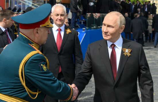 President of Russia Vladimir Putin on Red Square in Moscow, Commander-in-Chief of the Army Forces General Oleg Salyukov, left, and Defense Minister Andrei Belousov, center, where a military parade marking the 80th anniversary of Victory is taking place. Russia marks the 80th anniversary of Victory in the Great Patriotic War of 1941-1945. Location: Russia, Moscow. Author: Evgeny Biyatov/Sputnik. President of Russia Vladimir Putin and foreign leaders at military parade marking 80th anniversary of Victory