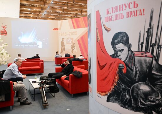 Journalists at the International Press Center covering the 80th anniversary of Victory in the Great Patriotic War. Location: Russia, Moscow. Author: Pelagiya Tikhonova/Sputnik. International Press Center covering 80th anniversary of Victory in Great Patriotic War