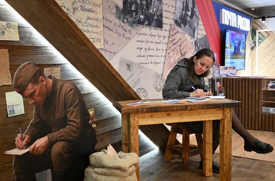 A journalist at the International Press Center covering the 80th anniversary of Victory in the Great Patriotic War. Location: Russia, Moscow. Author: Pelagiya Tikhonova/Sputnik. International Press Center covering 80th anniversary of Victory in Great Patriotic War
