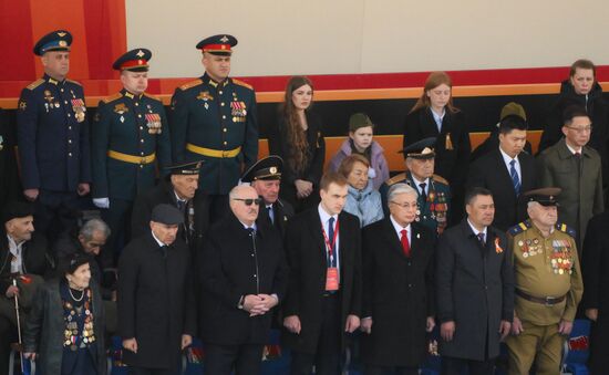 From left: Prime Minister of Armenia Nikol Pashinyan, President of Belarus Alexander Lukashenko with his son Nikolai, President of Kazakhstan Kassym-Jomart Tokayev, President of Kyrgyzstan Sadyr Japarov, and Great Patriotic War veteran Yevgeny Znamensky on Red Square in Moscow, where a military parade marking the 80th anniversary of Victory is taking place. Russia marks the 80th anniversary of Victory in the Great Patriotic War of 1941-1945. Location: Russia, Moscow. Author: Alexey Maishev/Sputnik. President of Russia Vladimir Putin and foreign leaders at military parade marking 80th anniversary of Victory