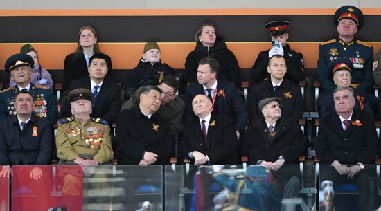 President of Russia Vladimir Putin and President of China Xi Jinping on Red Square in Moscow, where a military parade marking the 80th anniversary of Victory is taking place. Russia marks the 80th anniversary of Victory in the Great Patriotic War of 1941-1945. From left: President of Kyrgyzstan Sadyr Japarov and veteran of the Great Patriotic War Yevgeny Znamensky. From right: President of Turkmenistan Serdar Berdimuhamedov, President of Tajikistan Emomali Rahmon and veteran of the Great Patriotic War Ivan Martynushkin. Location: Russia, Moscow. Author: Sergey Guneev/Sputnik. President of Russia Vladimir Putin and foreign leaders at military parade marking 80th anniversary of Victory