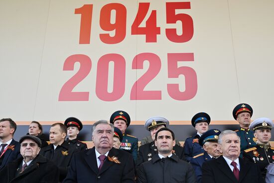 From left, foreground: veteran of the Great Patriotic War Ivan Martynushkin, President of Tajikistan Emomali Rahmon, President of Turkmenistan Serdar Berdimuhamedov and President of Uzbekistan Shavkat Mirziyoyev on Red Square in Moscow, where a military parade marking the 80th anniversary of Victory is taking place. Russia marks the 80th anniversary of Victory in the Great Patriotic War of 1941-1945. Location: Russia, Moscow. President of Russia Vladimir Putin and foreign leaders at military parade marking 80th anniversary of Victory