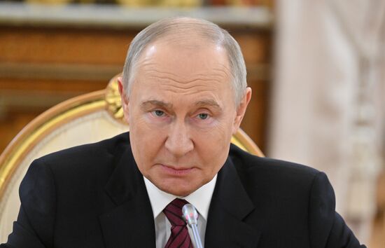 President of Russia Vladimir Putin meets with President of Palestine Mahmoud Abbas