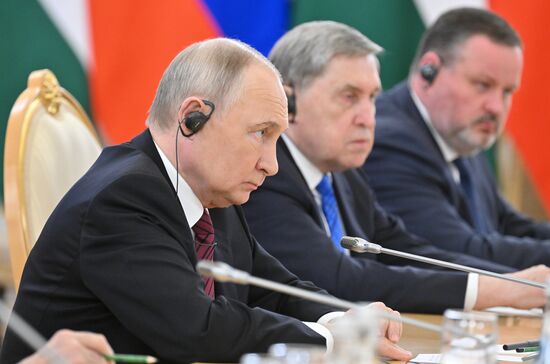 President of Russia Vladimir Putin meets with President of Palestine Mahmoud Abbas