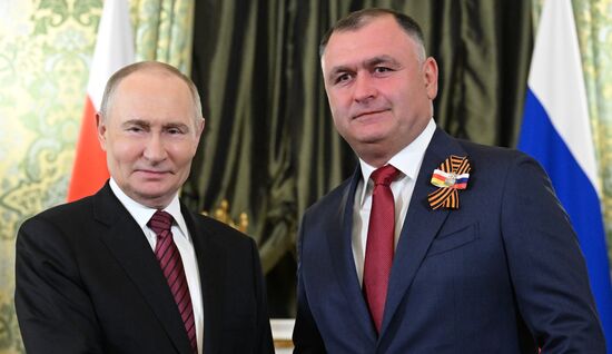 President of Russia Vladimir Putin meets with President of South Ossetia Alan Gagloev