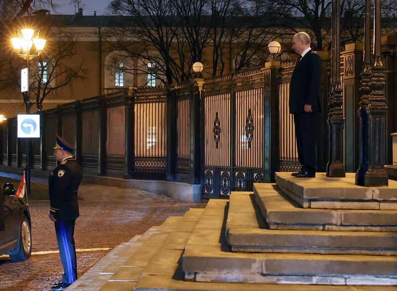 Russian President Vladimir Putin bids farewell to Hungarian Prime Minister Viktor Orban, as Commandant of the Moscow Kremlin Sergei Udovenko stands nearby, at the Kremlin in Moscow, Russia. Russia Hungary