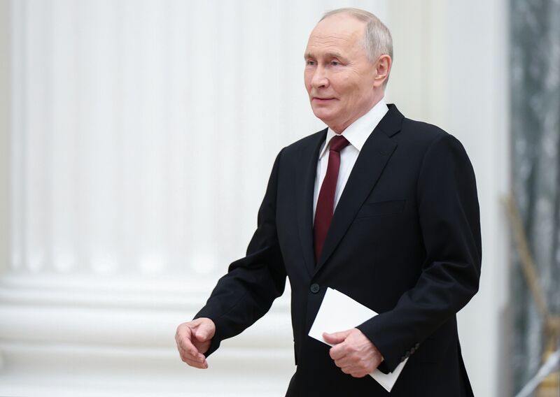 Russian President Vladimir Putin arrives to attend a meeting with participants of the 5th Congress of Young Scientists at the Kremlin in Moscow, Russia. Russia Putin Young Scientists