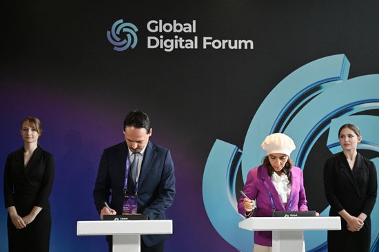 The 2nd Global Digital Forum. Signing ceremonies. Dmitry Fofanov, Editor-in-Chief, IT-Russia; Ikram Zaoudi, Director, Communication Box; Expert, Global Fact-Checking Network (GFCN) (Algeria). Location: Russia, Moscow. Author: Maksim Blinov/Sputnik. Global Digital Forum 2026. Signing ceremonies