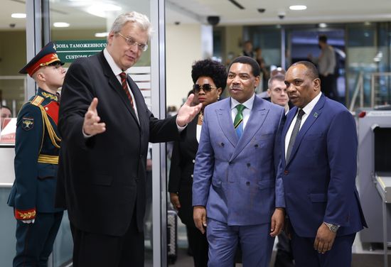 Prime Minister of Tanzania Mwigulu Lameck Nchemba arrives in Moscow for the 3rd Russia-Africa Summit and Forum. Second left: Prime Minister's wife, Neema Mwigulu. Left: Deputy Director of the Department of State Protocol of the Russian Foreign Ministry Andrei Milyayev. Location: Russia, Moscow. Author: Artem Pryakhin/Sputnik. Prime Minister of Tanzania Mwigulu Lameck Nchemba arrives in Moscow