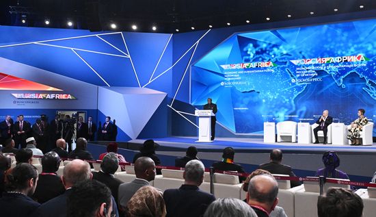 President of Burundi, Chairperson of the African Union Evariste Ndayishimiye is seen speaking at the plenary session of the Russia-Africa Economic and Humanitarian Forum in Moscow. From right: Director of the Institute for African Studies of the Russian Academy of Sciences Irina Abramova and Russian President Vladimir Putin. Location: Russia, Moscow. Author: Sergey Bobylev/Sputnik. Plenary session of Russia-Africa Forum in Moscow